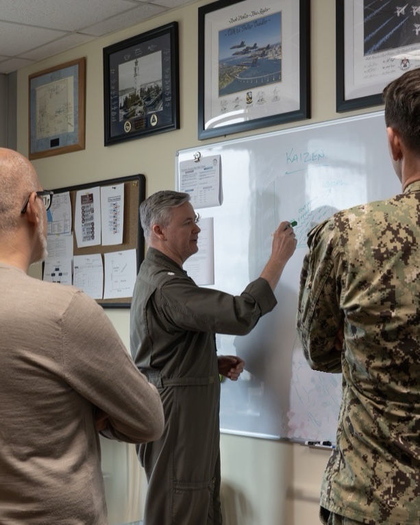 Ed Chandler at a whiteboard, leading a session with a leadership team