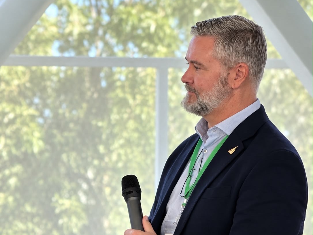 Ed Chandler listening to a fellow panellist during a fireside session at Startup Summit Lisbon